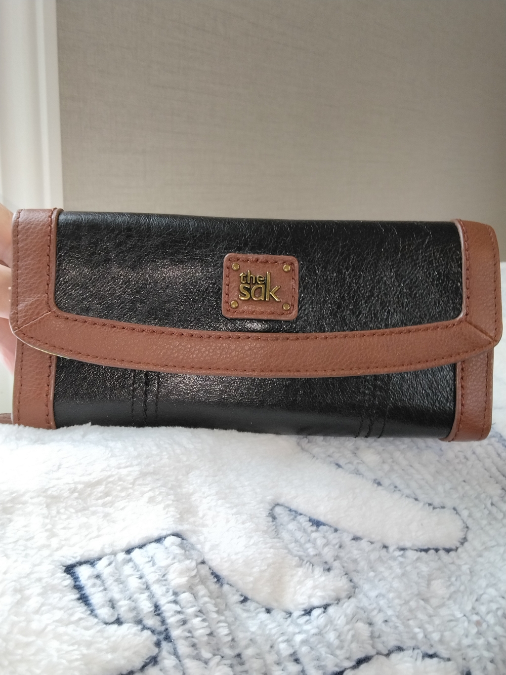 The Sak Black and Brown Leather Clutch Wallet